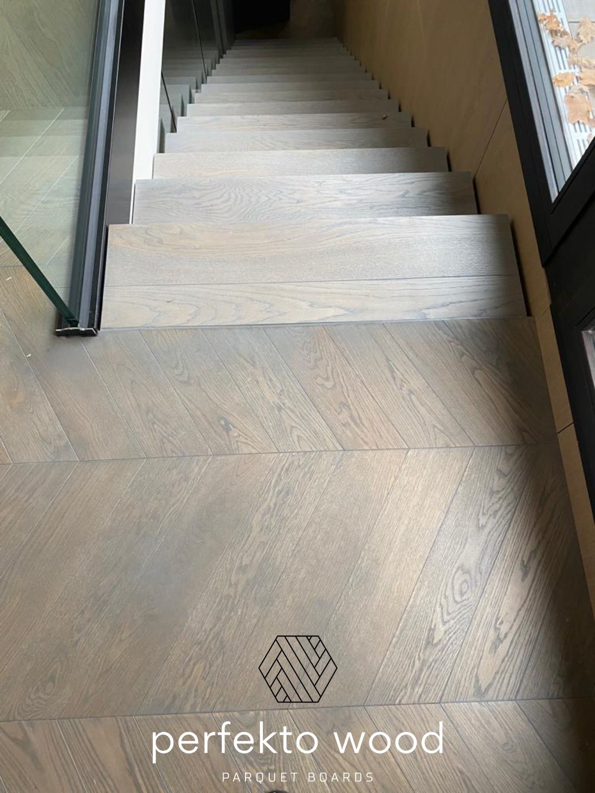 Chevron parquet 45° installed Geneva Switzerland — engineered oak 12mm Select grade PerfektoWood