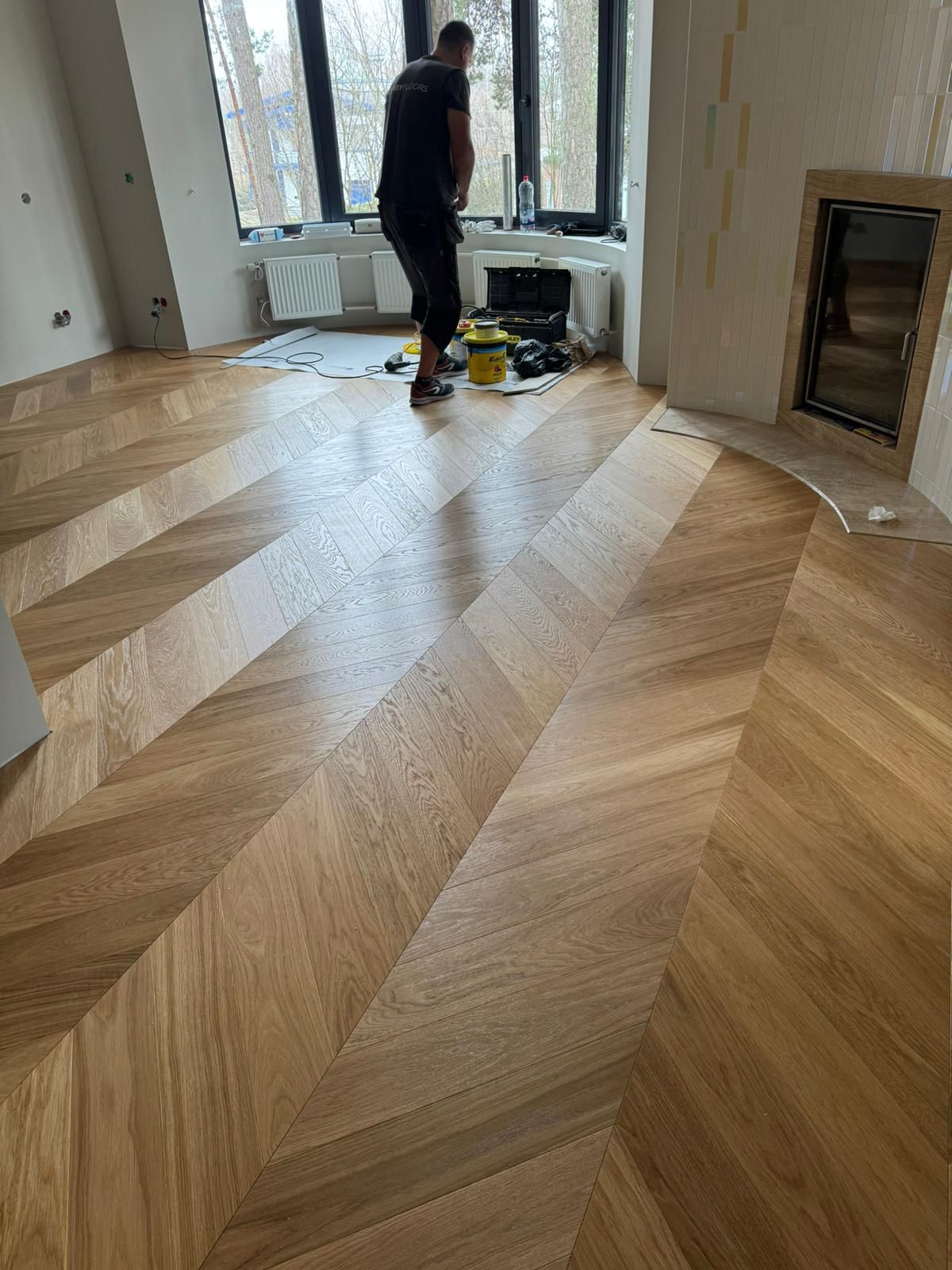 Chevron pattern 45 degree oak parquet UV oiled 4-side bevel &mdash; residential project Riga Latvia